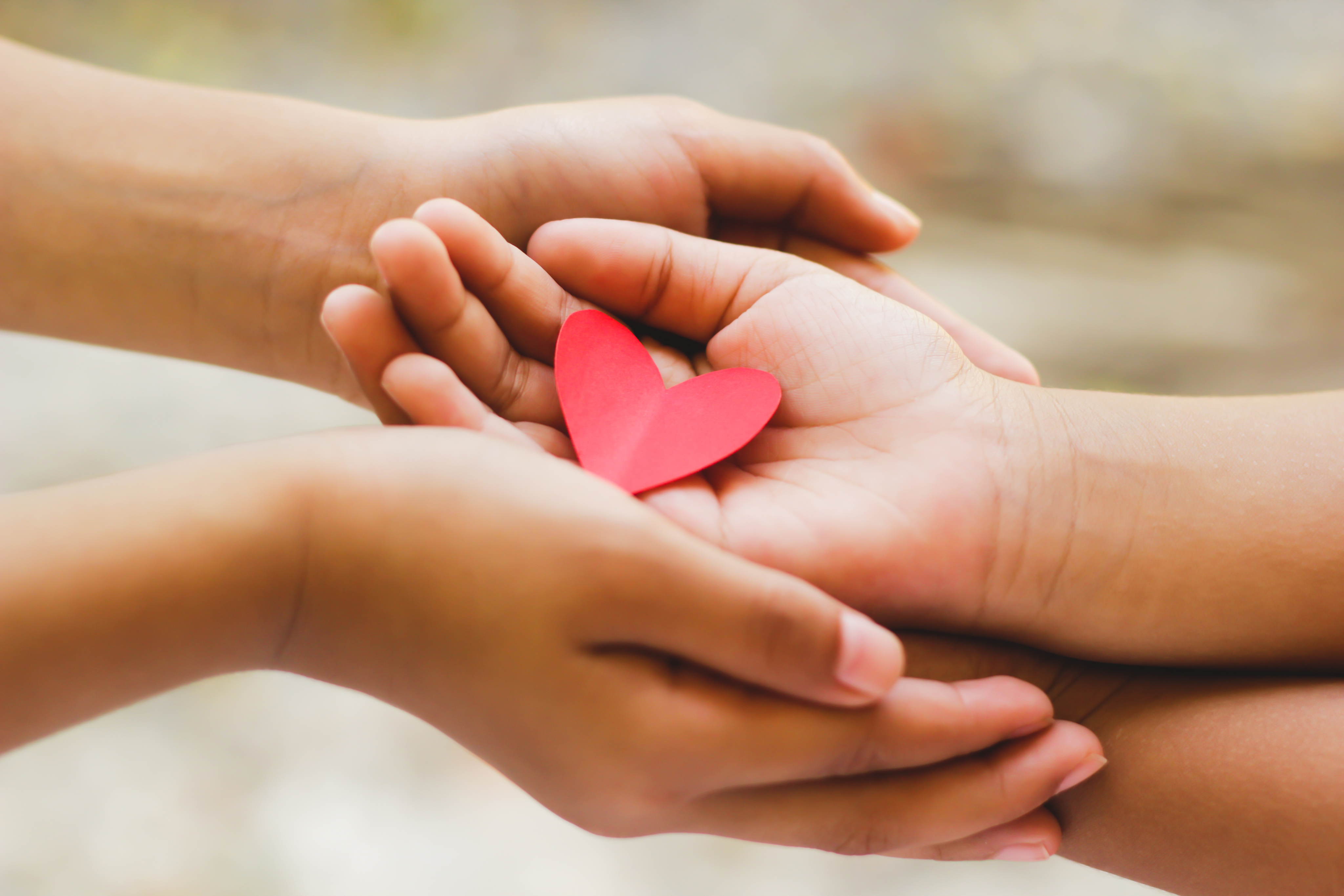 Charitable giving hands with heart