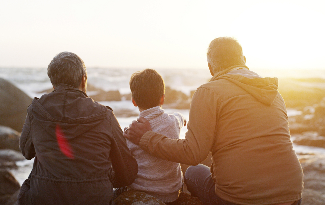 Family walking together on the beach